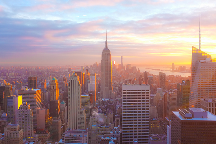 A few of the New York City skyline at sunset