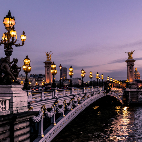 A shot of a bridge at dusk in Paris, France