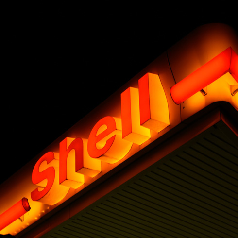 Shell sign at night