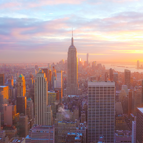 A few of the New York City skyline at sunset