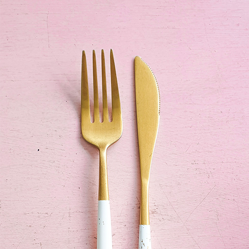 A gold fork and knife