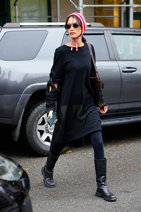 Bella Hadid walking down the street in an all-black ensemble