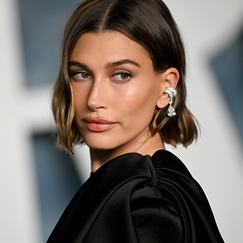 Hailey Bieber looks at the camera at the Vanity Fair Oscars party in 2023