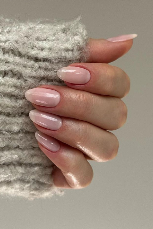 A shot of a milky nude almond-shaped nail