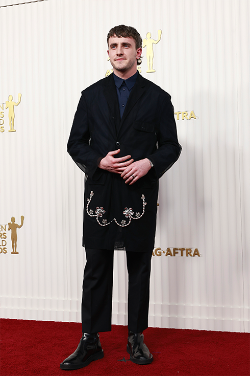 Paul Mescal in a long black suit jacket with light embroidery